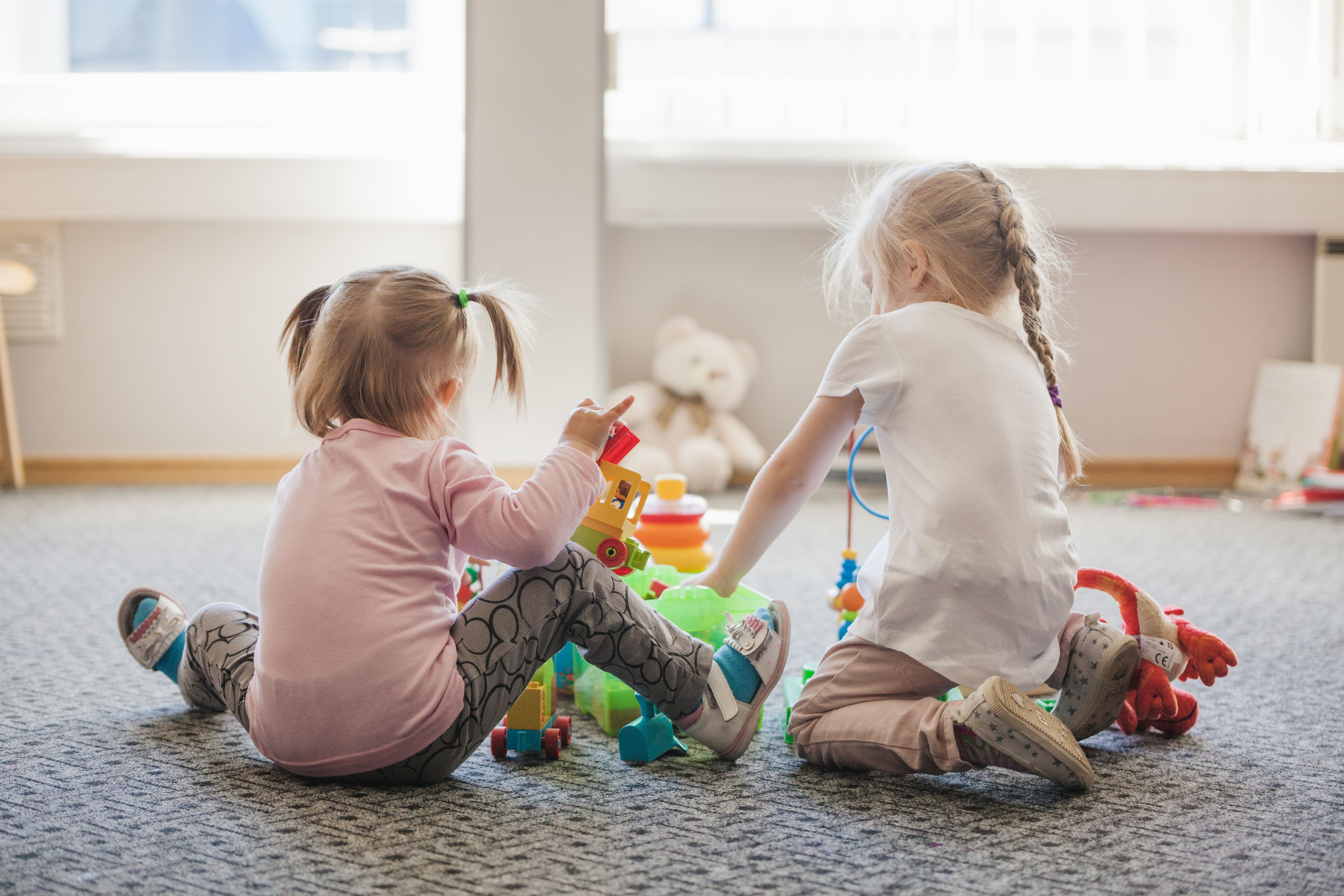 two-little-girls-sitting-floor-playing (1).jpg